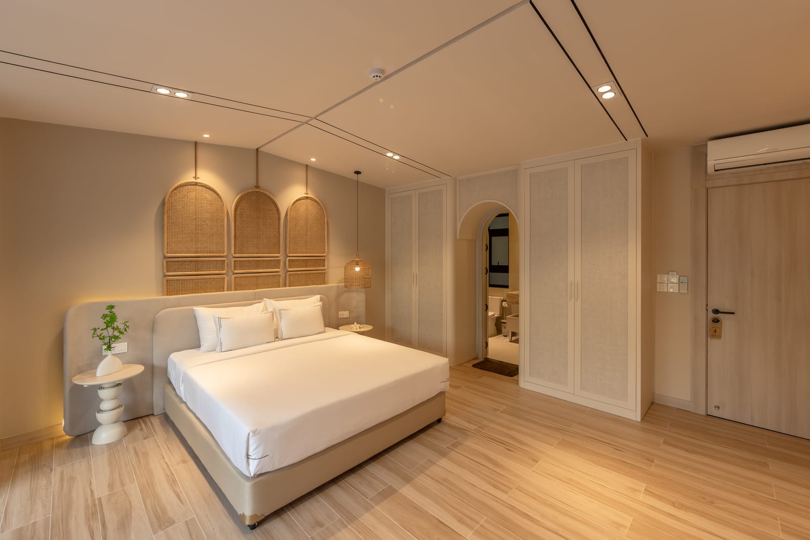 Guest room with woven headboard
