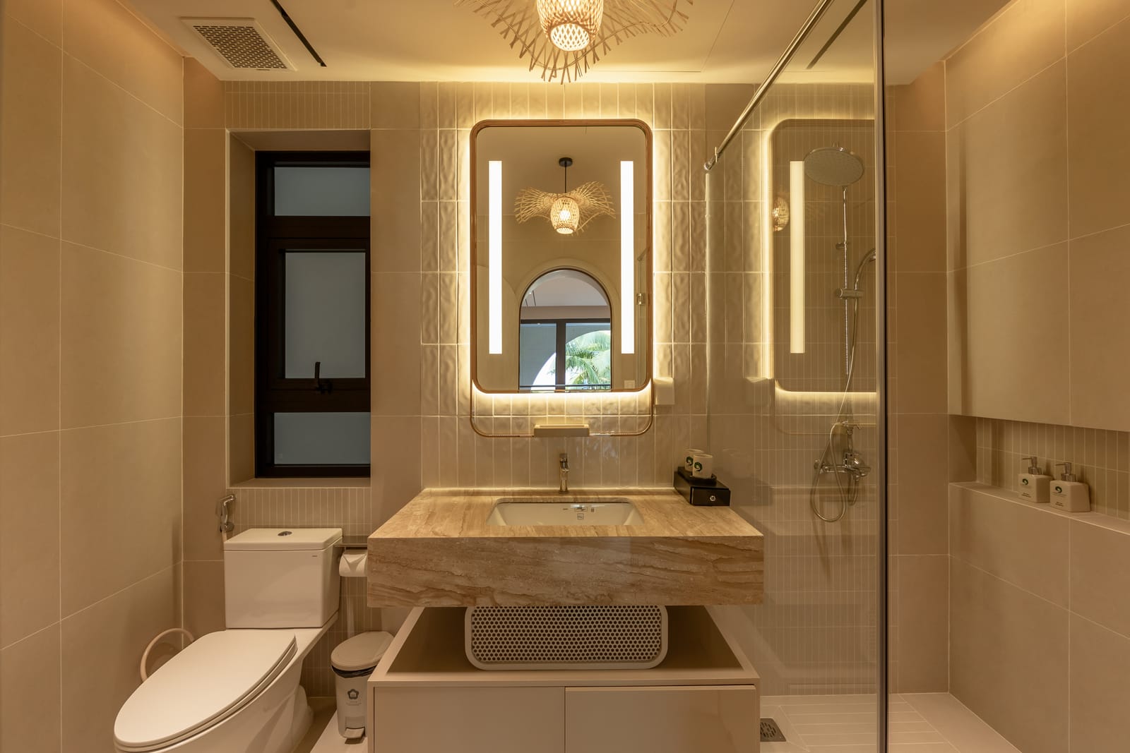 Bathroom and illuminated vanity